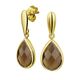 Gouden oorhangers rookkwarts