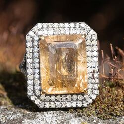 Gouden ring met rutielkwarts en 0.90 crt diamant indiagem