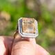 Gouden ring met rutielkwarts en 0.90 crt diamant indiagem