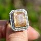 Gouden ring met rutielkwarts en 0.90 crt diamant indiagem