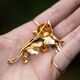 Vintage 18krt gouden broche panter met 2 robijnen 10 briljanten