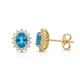 14krt gouden oorstekers London Blue topaas en diamant sale