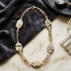 Rutielkwarts, jasper en zoetwaterparel collier verguld slot