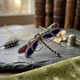 Zilveren libel met rood en blauw emaille, markasiet en robijntjes