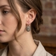 Verguld zilver oorbellen grijs cat eye strass