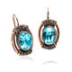 roséverguld oorbellen blauw strass