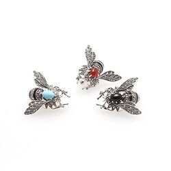 Zilveren broche vlieg bezet met carneool en markasiet