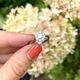 Witgouden ring met diamant baguette en briljant bloem