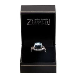 Zilveren ring met blauw topaas met kleine pareltjes