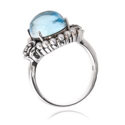 Zilveren ring met blauw topaas met kleine pareltjes