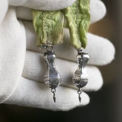 Zilveren breipendoppen met kwastjes 19e eeuws Nederland