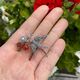 Zilveren broche vogel granaat en carneool