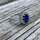 Zilveren ring grote blauwe zirkonia met witte kleintjes