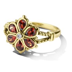 Geelgouden vintage ring bloem granaatjes en diamant