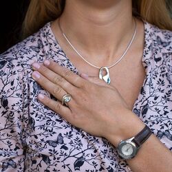 Bicolor zilveren ring met topaasje