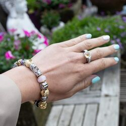 Christina vergulde charms met roze glas met bubbels