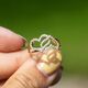Gouden ring twee verbonden harten met briljant
