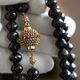 Collier granaat met gouden bolslot